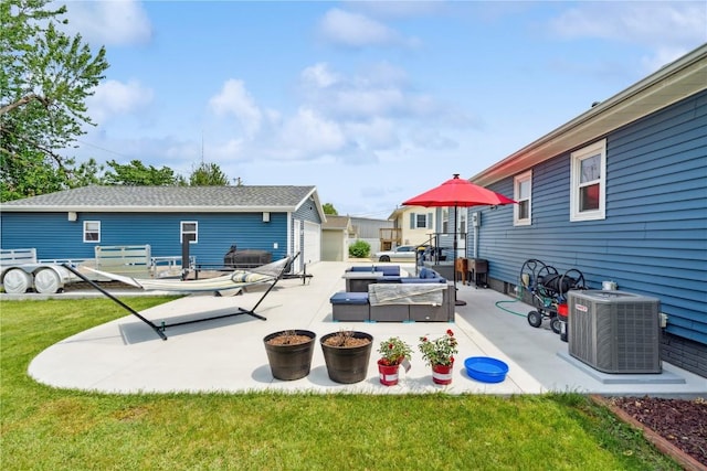 1026 Eisenhower Rd, Hiawatha, IA 52233 - view of patio / terrace with central AC, an outdoor hangout area, and an outbuilding