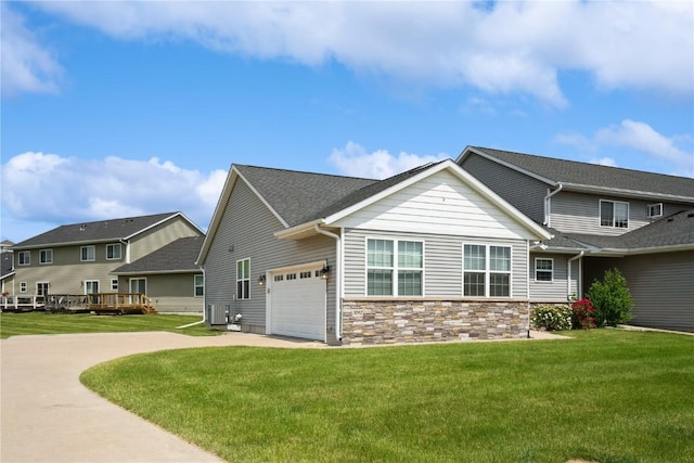 3092 Sherwood Dr, Marion, IA 52302 - view of side of property with a lawn, a garage, concrete driveway, and stone siding