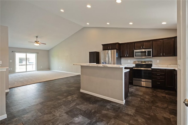 3092 Sherwood Dr, Marion, IA 52302 - kitchen featuring appliances with stainless steel finishes, light countertops, a kitchen island, a ceiling fan, and dark brown cabinets