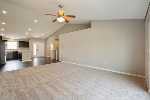3092 Sherwood Dr, Marion, IA 52302 - unfurnished living room featuring dark colored carpet, ceiling fan, recessed lighting, and vaulted ceiling