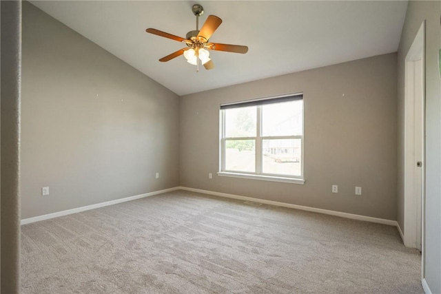 3092 Sherwood Dr, Marion, IA 52302 - carpeted spare room with vaulted ceiling and a ceiling fan