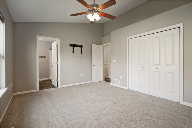 3092 Sherwood Dr, Marion, IA 52302 - unfurnished bedroom featuring vaulted ceiling, a closet, carpet, ensuite bath, and a ceiling fan