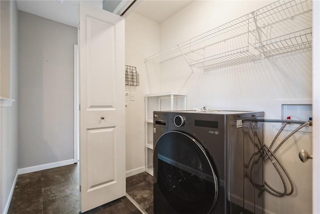3092 Sherwood Dr, Marion, IA 52302 - washroom with washer / clothes dryer and dark stone finish floors