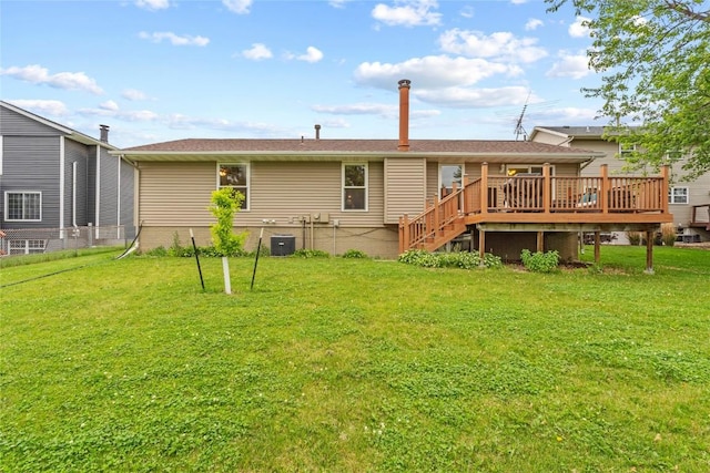 6813 Terrazzo Dr NW, Cedar Rapids, IA 52405 - rear view of house with a wooden deck, a yard, stairway, and central AC