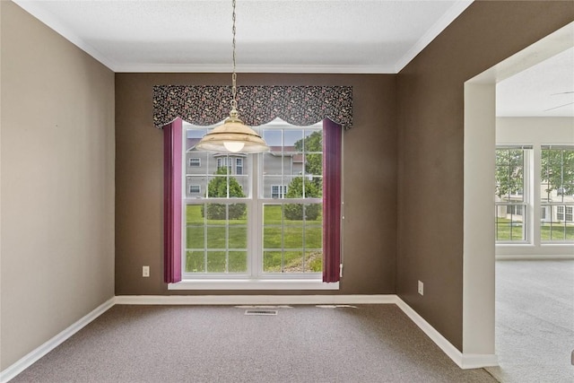 4555 Westchester Dr NE Unit A, Cedar Rapids, IA 52402 - unfurnished dining area featuring carpet floors, baseboards, plenty of natural light, and crown molding