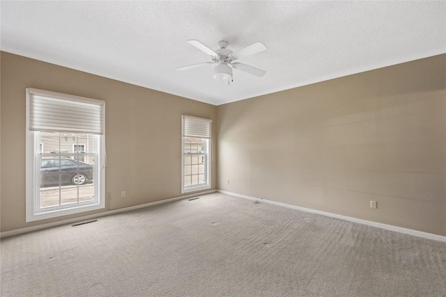 4555 Westchester Dr NE Unit A, Cedar Rapids, IA 52402 - empty room with a ceiling fan, carpet flooring, baseboards, a textured ceiling, and crown molding