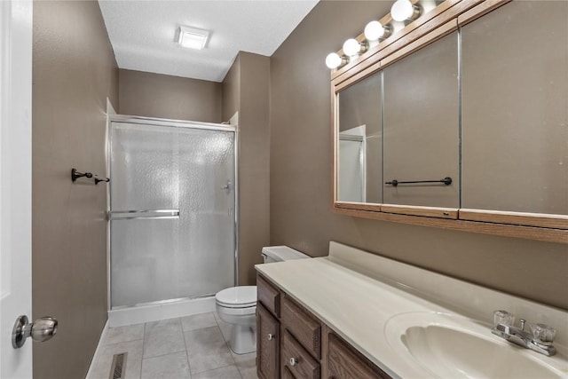 4555 Westchester Dr NE Unit A, Cedar Rapids, IA 52402 - bathroom with a stall shower, vanity, toilet, and tile patterned floors