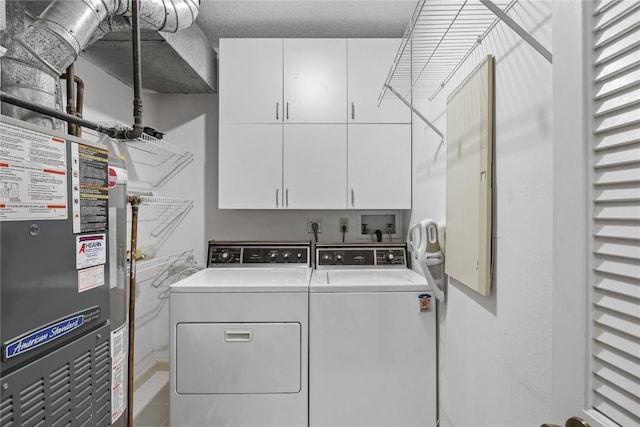 4555 Westchester Dr NE Unit A, Cedar Rapids, IA 52402 - washroom with washing machine and dryer and cabinet space