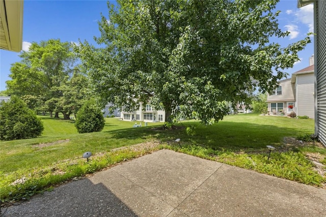 4555 Westchester Dr NE Unit A, Cedar Rapids, IA 52402 - view of grassy yard with a patio