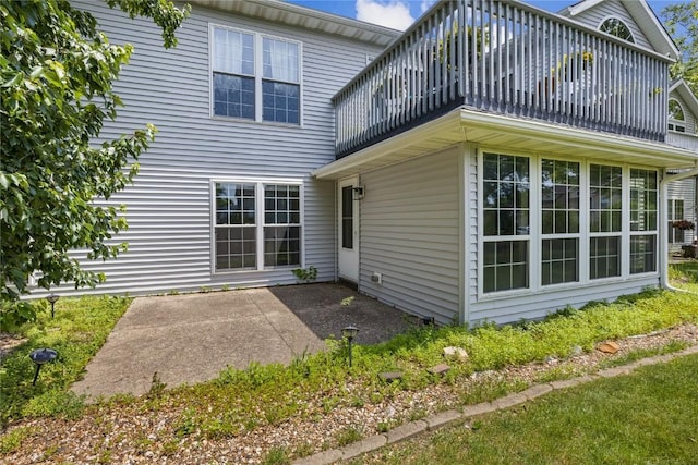 4555 Westchester Dr NE Unit A, Cedar Rapids, IA 52402 - back of property with a balcony and a patio