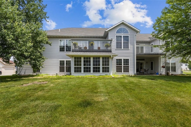 4555 Westchester Dr NE Unit A, Cedar Rapids, IA 52402 - rear view of house featuring a balcony and a yard