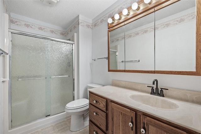 4111 Blue Jay Dr NE Unit A, Cedar Rapids, IA 52402 - bathroom with vanity, toilet, a shower stall, and a textured ceiling