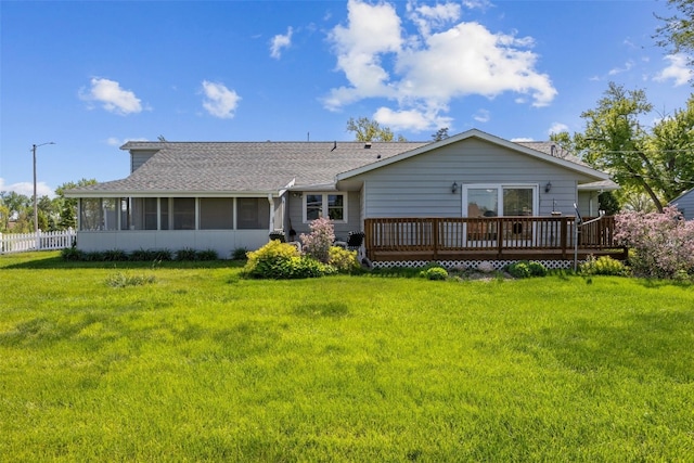 4324 C Ave NE, Cedar Rapids, IA 52402 - back of house with a sunroom, a wooden deck, and a shingled roof