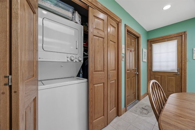 4324 C Ave NE, Cedar Rapids, IA 52402 - laundry area with stacked washing machine and dryer, light tile patterned floors, and recessed lighting