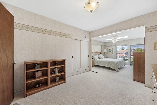 4324 C Ave NE, Cedar Rapids, IA 52402 - bedroom featuring a skylight, access to outside, and light carpet