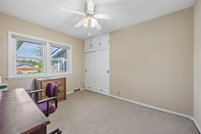 4324 C Ave NE, Cedar Rapids, IA 52402 - home office featuring light colored carpet, baseboards, and ceiling fan