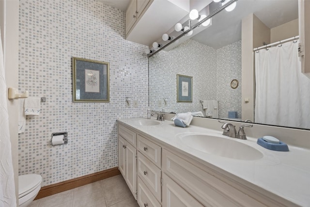 4324 C Ave NE, Cedar Rapids, IA 52402 - bathroom featuring double vanity, tile patterned floors, toilet, baseboards, and a shower with shower curtain