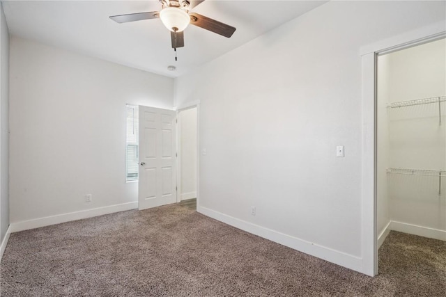 208 Northgate St, Shellsburg, IA 52332 - unfurnished bedroom featuring carpet flooring, a walk in closet, and a closet
