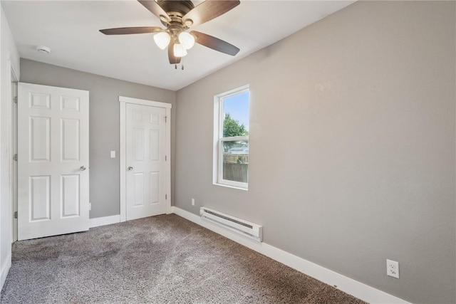 208 Northgate St, Shellsburg, IA 52332 - unfurnished bedroom featuring a baseboard radiator, carpet flooring, and ceiling fan