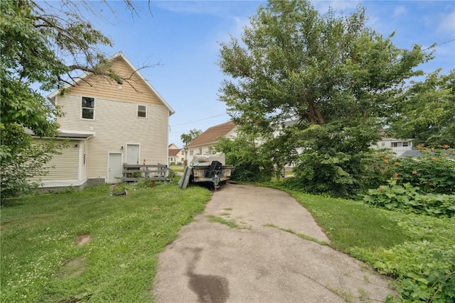 208 Northgate St, Shellsburg, IA 52332 - view of side of property featuring a yard and driveway