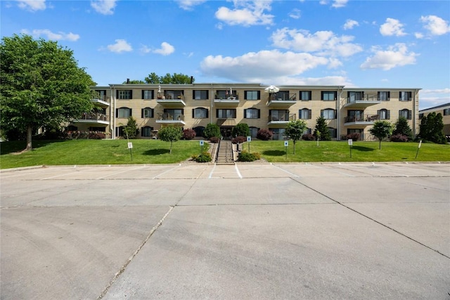 2131 1st Ave SE Unit 116, Cedar Rapids, IA 52403 - view of apartment building / complex featuring uncovered parking