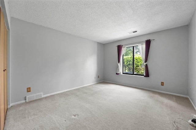 2131 1st Ave SE Unit 116, Cedar Rapids, IA 52403 - carpeted empty room with a textured ceiling and baseboards