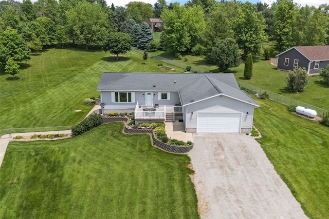 1782 Baker Ave, West Branch, IA 52358 - view of front facade featuring an attached garage, driveway, and a wooden deck