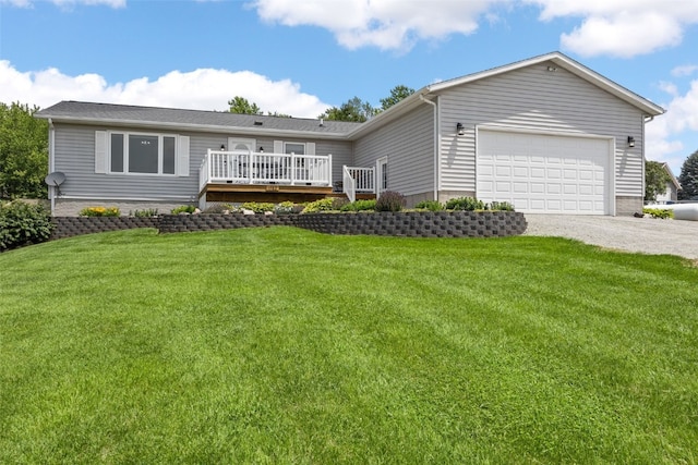1782 Baker Ave, West Branch, IA 52358 - single story home featuring driveway, a deck, a front yard, and an attached garage
