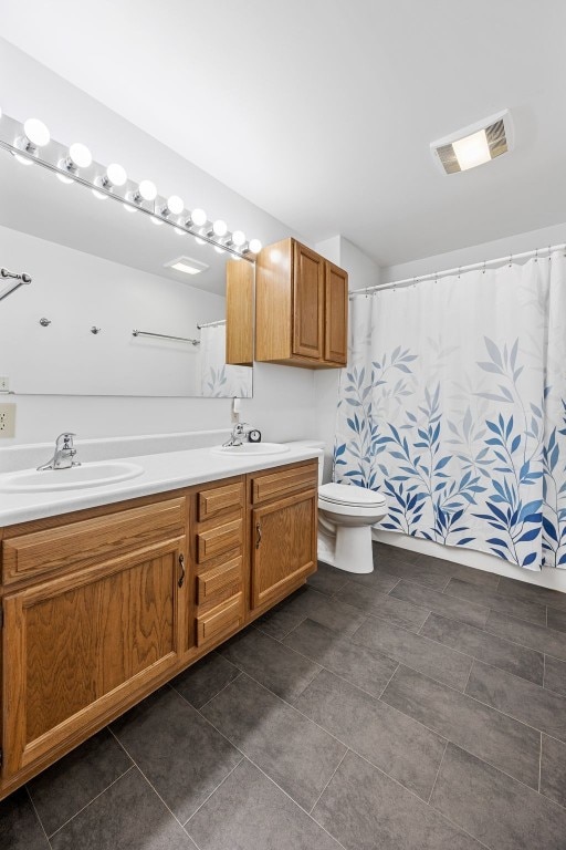 1782 Baker Ave, West Branch, IA 52358 - full bath featuring double vanity, tile patterned flooring, and curtained shower