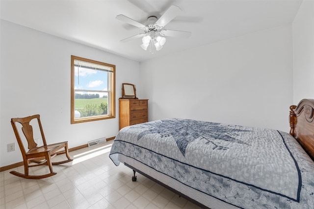 1782 Baker Ave, West Branch, IA 52358 - bedroom with light flooring and a ceiling fan