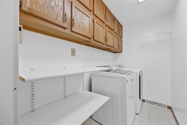 1782 Baker Ave, West Branch, IA 52358 - laundry room with washing machine and clothes dryer and cabinet space