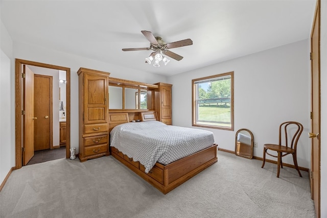 1782 Baker Ave, West Branch, IA 52358 - bedroom featuring light carpet and a ceiling fan