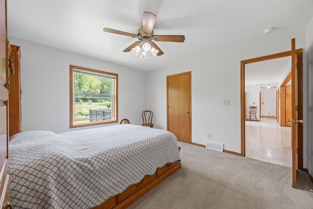 1782 Baker Ave, West Branch, IA 52358 - bedroom featuring light carpet and ceiling fan