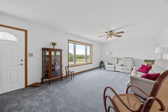 1782 Baker Ave, West Branch, IA 52358 - carpeted living area with a ceiling fan and baseboards