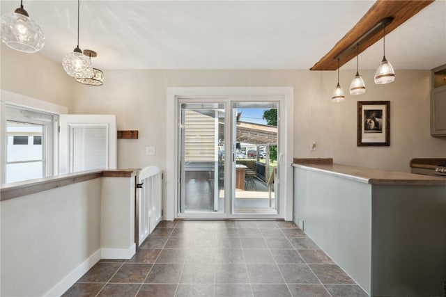 452 Lewellen Dr NW, Cedar Rapids, IA 52405 - kitchen featuring baseboards, hanging light fixtures, and a chandelier