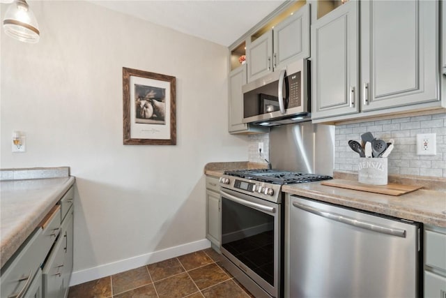 452 Lewellen Dr NW, Cedar Rapids, IA 52405 - kitchen with appliances with stainless steel finishes, baseboards, backsplash, and light countertops