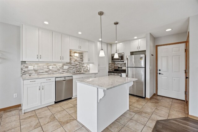 2273 Holiday Rd, Coralville, IA 52241 - kitchen featuring stainless steel appliances, white cabinetry, tasteful backsplash, a sink, and recessed lighting