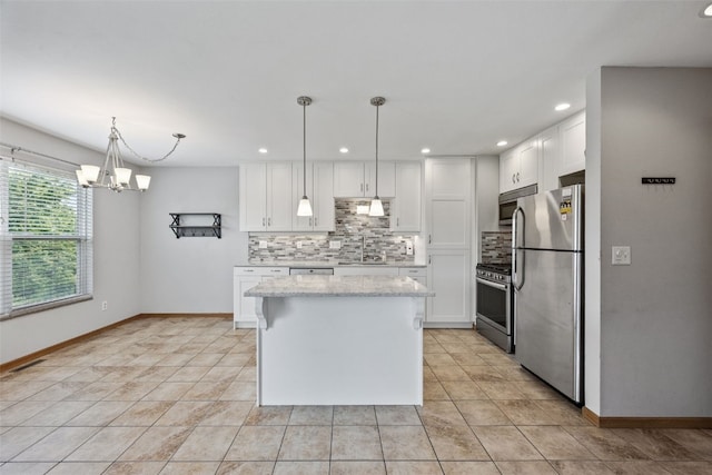 2273 Holiday Rd, Coralville, IA 52241 - kitchen featuring appliances with stainless steel finishes, tasteful backsplash, white cabinetry, and recessed lighting