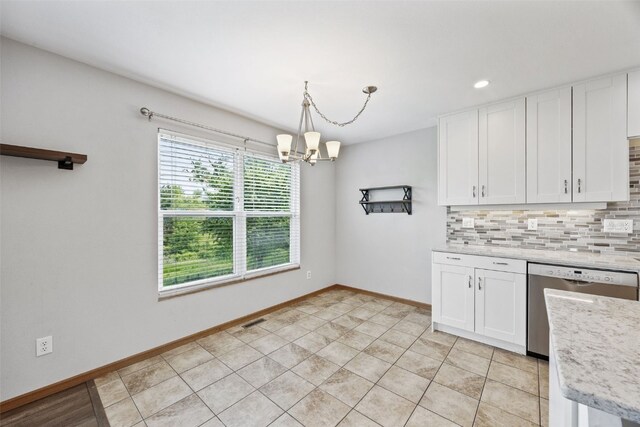 2273 Holiday Rd, Coralville, IA 52241 - kitchen featuring backsplash, a chandelier, white cabinets, and recessed lighting