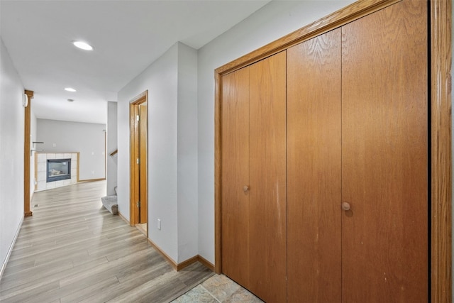 2273 Holiday Rd, Coralville, IA 52241 - hallway featuring light wood finished floors, baseboards, recessed lighting, and stairs