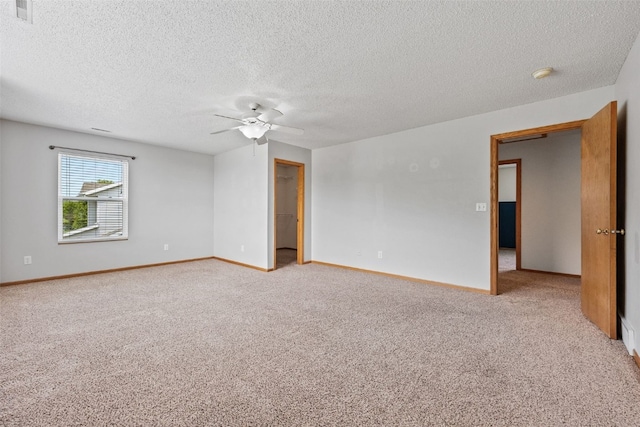 2273 Holiday Rd, Coralville, IA 52241 - carpeted empty room with a ceiling fan, a textured ceiling, baseboards, and a smoke detector