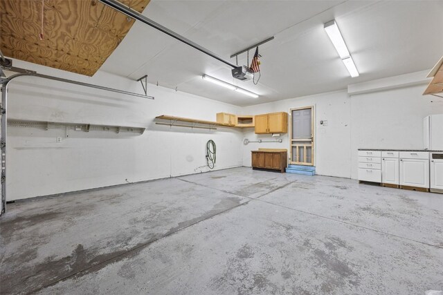 2273 Holiday Rd, Coralville, IA 52241 - garage featuring a garage door opener