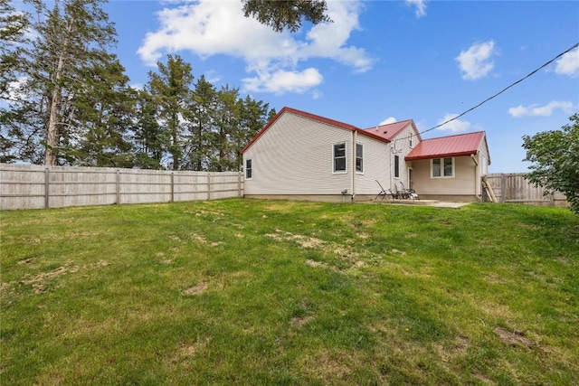 3152 66th St, Shellsburg, IA 52332 - back of house featuring a patio area and metal roof