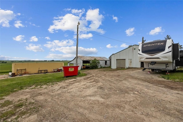 3152 66th St, Shellsburg, IA 52332 - view of yard featuring an outbuilding and a detached garage