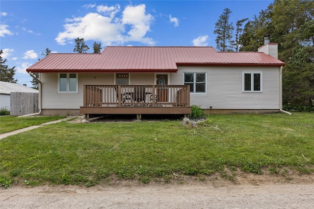 3152 66th St, Shellsburg, IA 52332 - rear view of property with a yard, metal roof, a deck, and a chimney