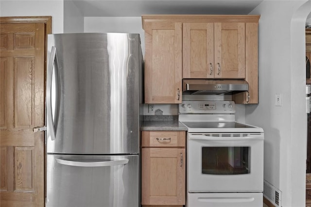 3152 66th St, Shellsburg, IA 52332 - kitchen featuring freestanding refrigerator, white range with electric stovetop, under cabinet range hood, arched walkways, and light brown cabinetry