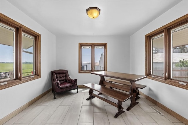 3152 66th St, Shellsburg, IA 52332 - living area with healthy amount of natural light, baseboards, and light tile patterned floors