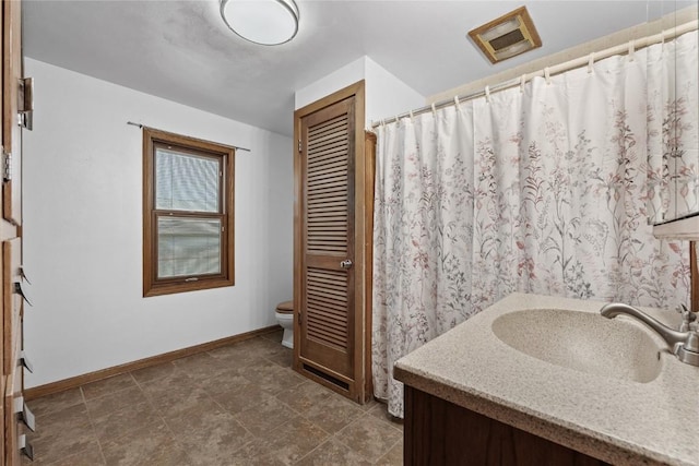 3152 66th St, Shellsburg, IA 52332 - full bathroom featuring toilet, vanity, and baseboards