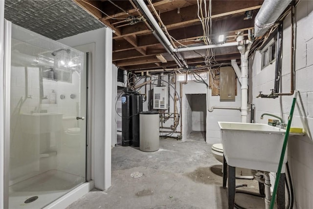 3152 66th St, Shellsburg, IA 52332 - unfinished below grade area with a water softener system, water heater, electric panel, concrete block wall, and a sink
