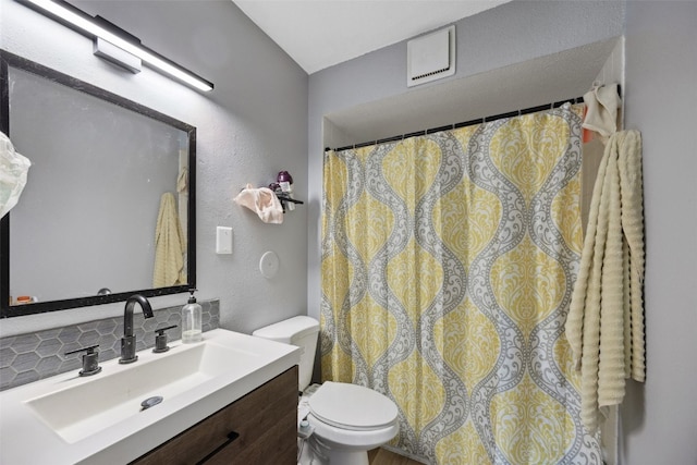 849 Kerry Ln SE Unit 49, Cedar Rapids, IA 52403 - full bath with toilet, vanity, and tasteful backsplash